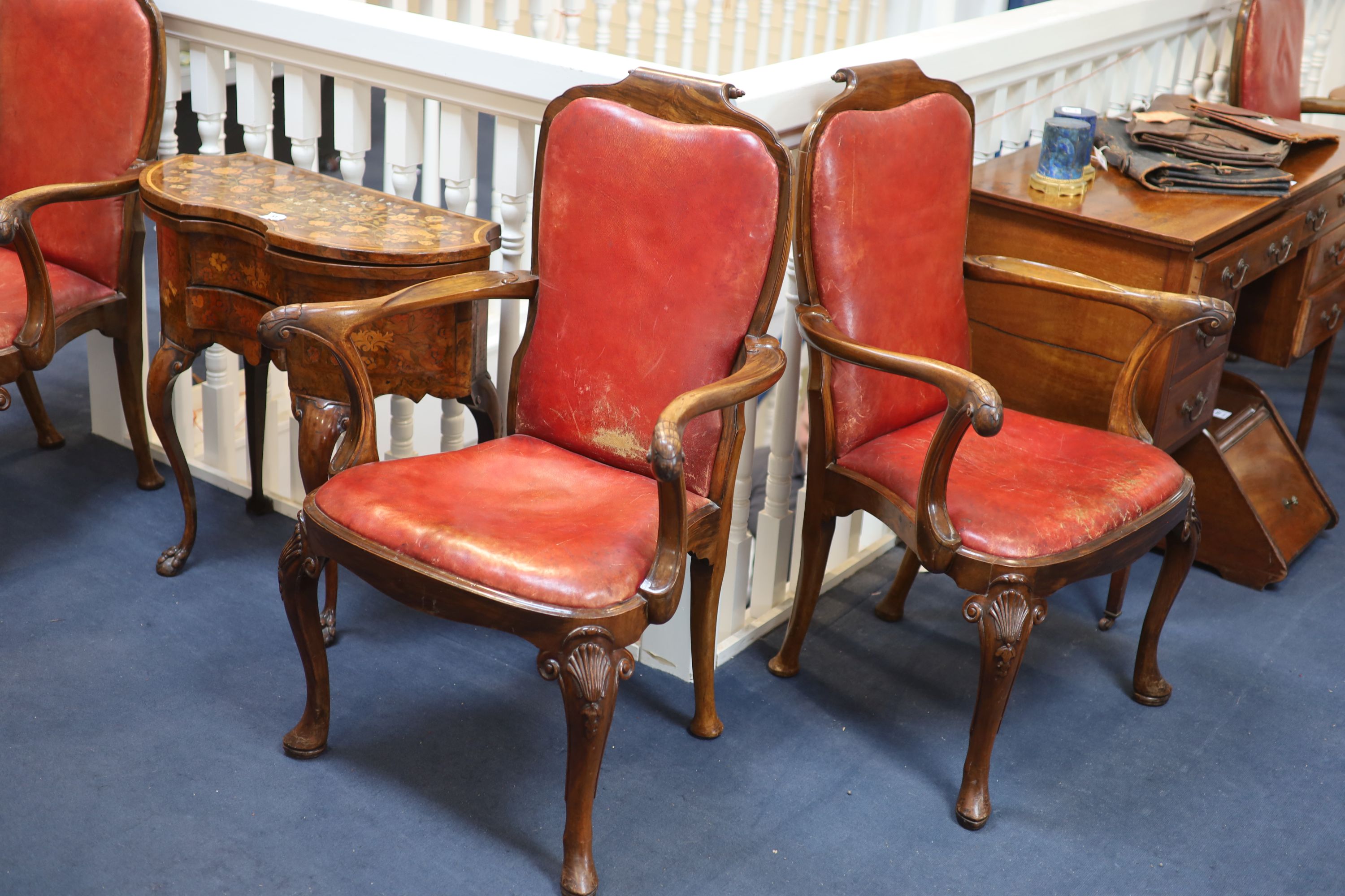 A set of four George I style walnut armchairs, first quarter 20th century,